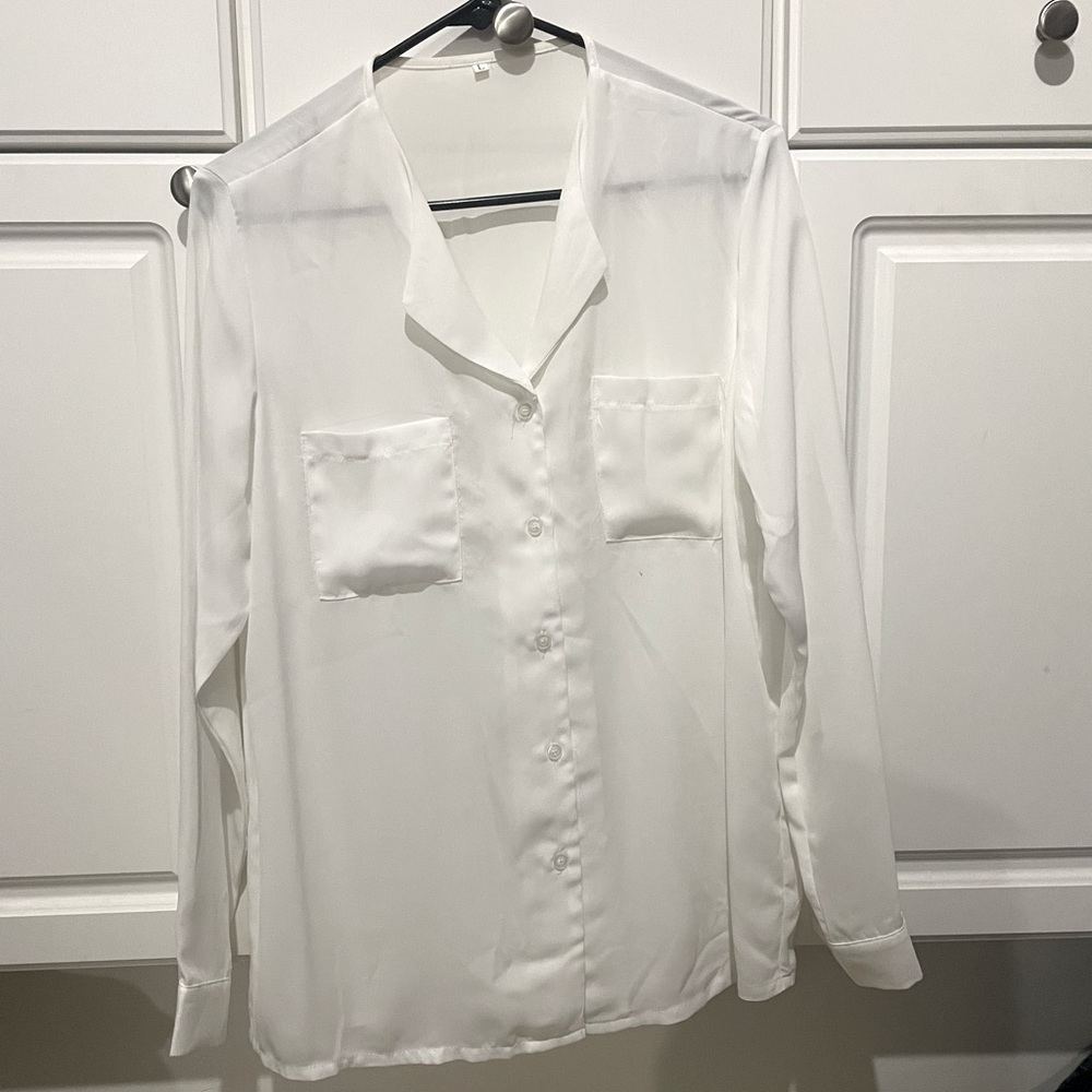 Women’s large button-down the front shirt with pockets. Long sleeve. White.